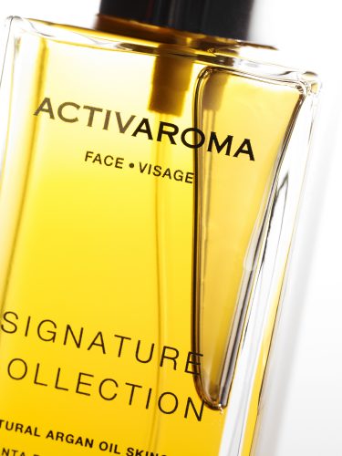 cosmetic image shots closeup pure argan oil bottle signature collection face