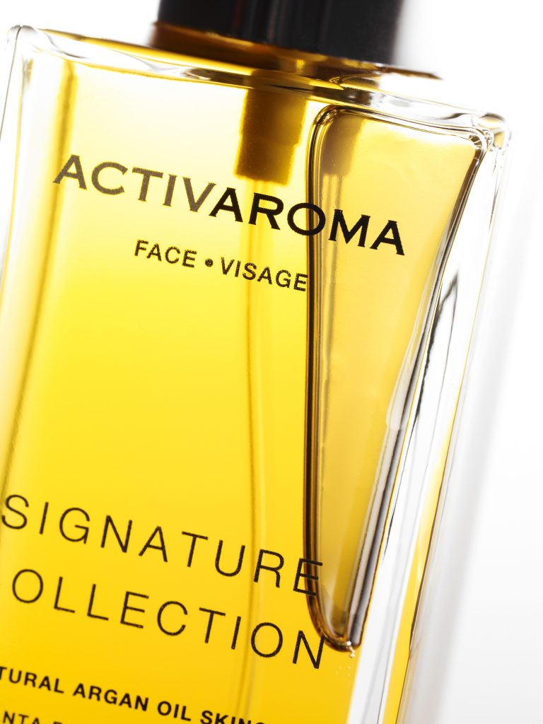 cosmetic image shots closeup pure argan oil bottle signature collection face