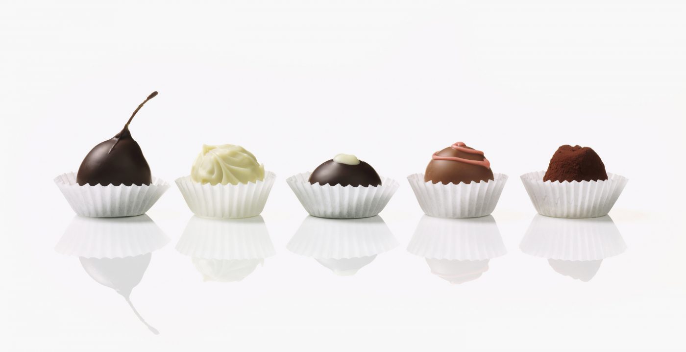 row of different Chocolate next to each other with reflection