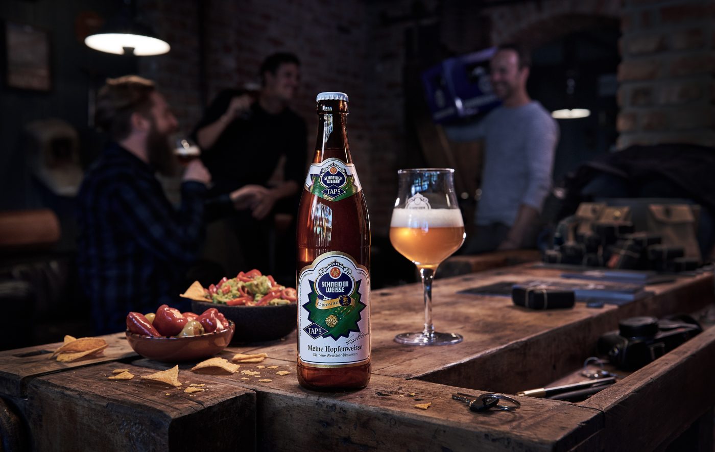hopfenweisse wheat beer in loft with people drinking beer