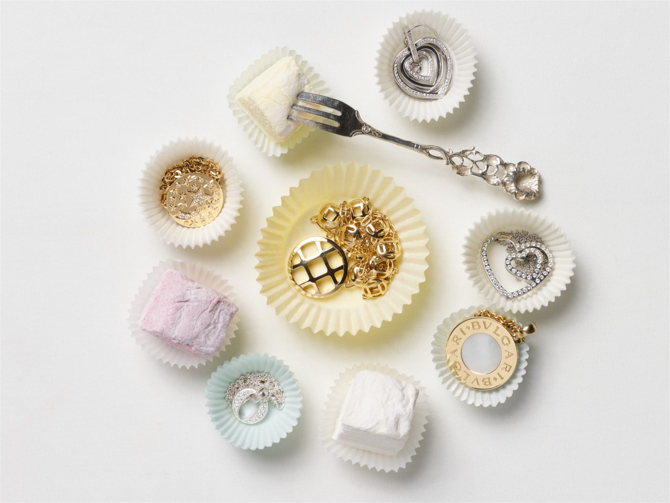 jewelry on marshmallows editorial shot of chains and rings