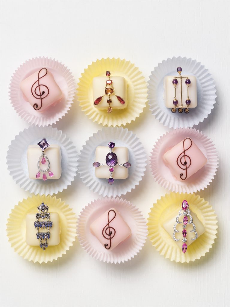 jewelry on petit fours editorial shot of chains and rings