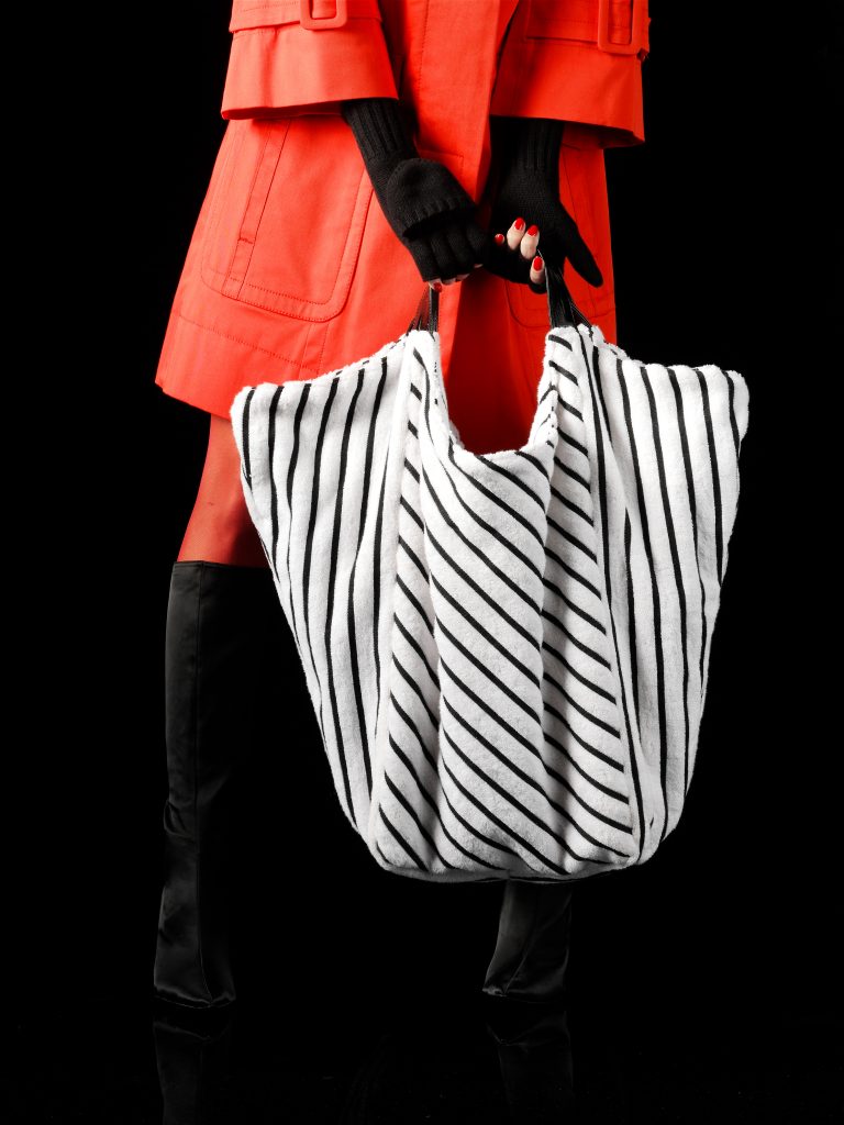 woman with striped handbag red coat black boots people stills zoeppritz accesories