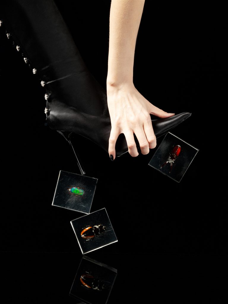 black boots with womans hand and bugs people stills zoeppritz