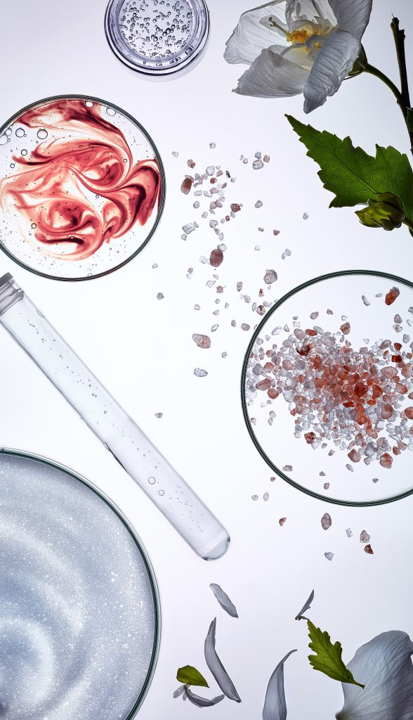 cosmetic products as well as ingredients, plants and lab utensils were arranged into a technical still life