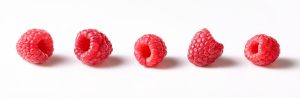 several raspberrys on white underground for pack shots