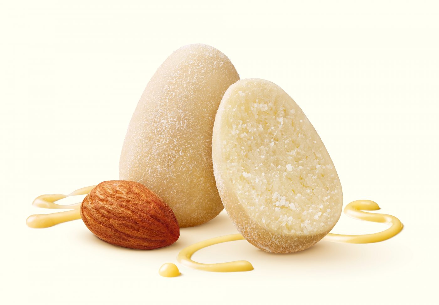 you can see a marzipan egg divided in the middle. Outside you can see an almond and liquid white chocolate strips for the packaging photography