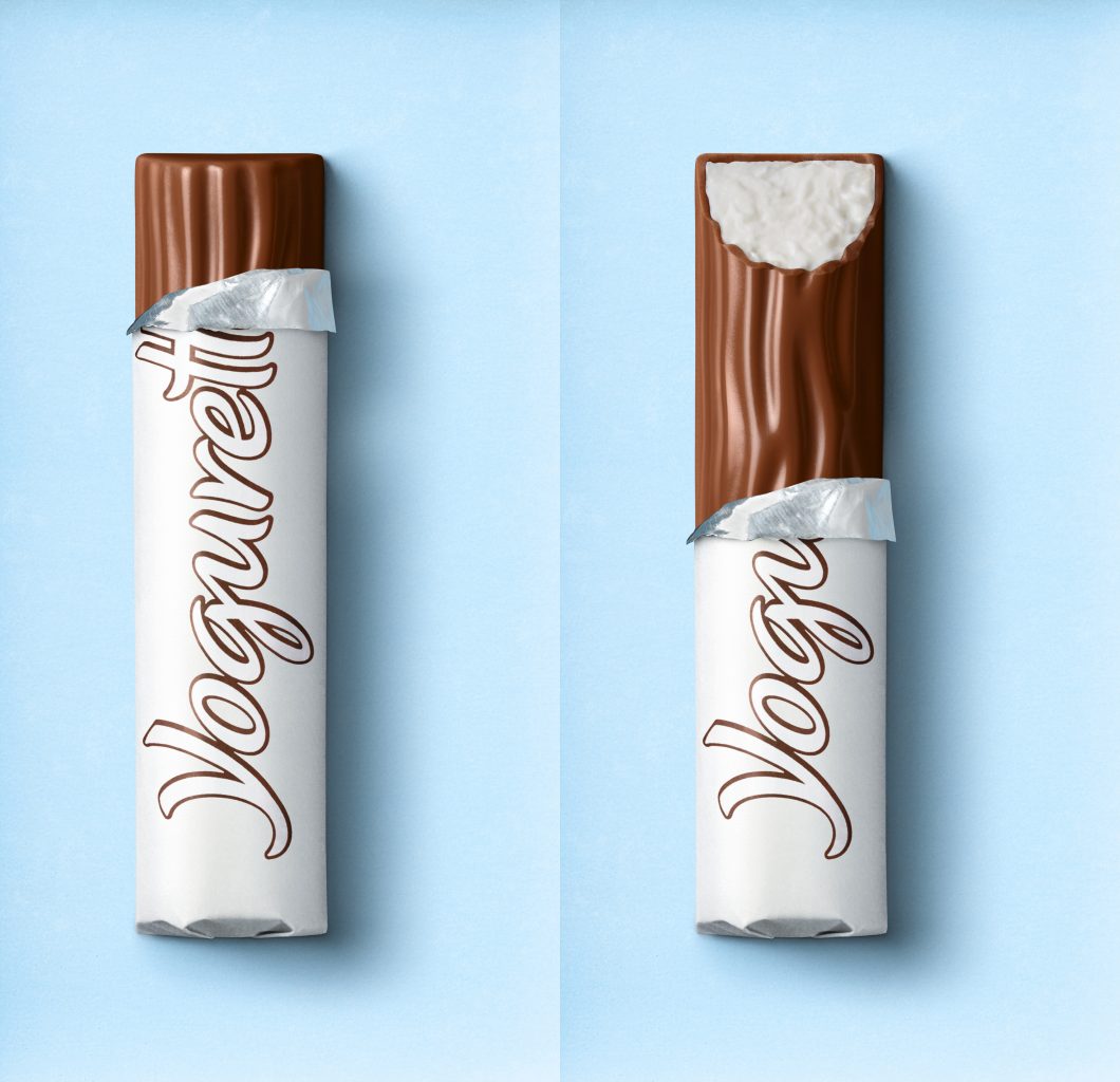 Packaging relaunch for the yogurt packaging. A bitten Yoguretten Yogurt Sensation chocolate bar and an unbitten white chocolate bar lie on a blue background, both are wraped in a Paper