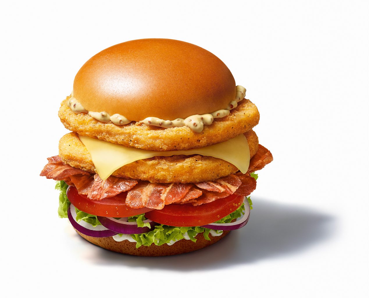 Mc Donald's Promotion Oktoberfest 2019, a big Signature_Bacon_Deluxe_Chicken Hamburger Signature Bacon Egg stands on white background